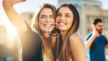 A couple of women smiling.