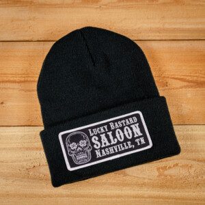 A LBS Knit Beanie with a skull on it.