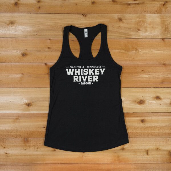 Whiskey river saloon Tank Top in full Black color on a table