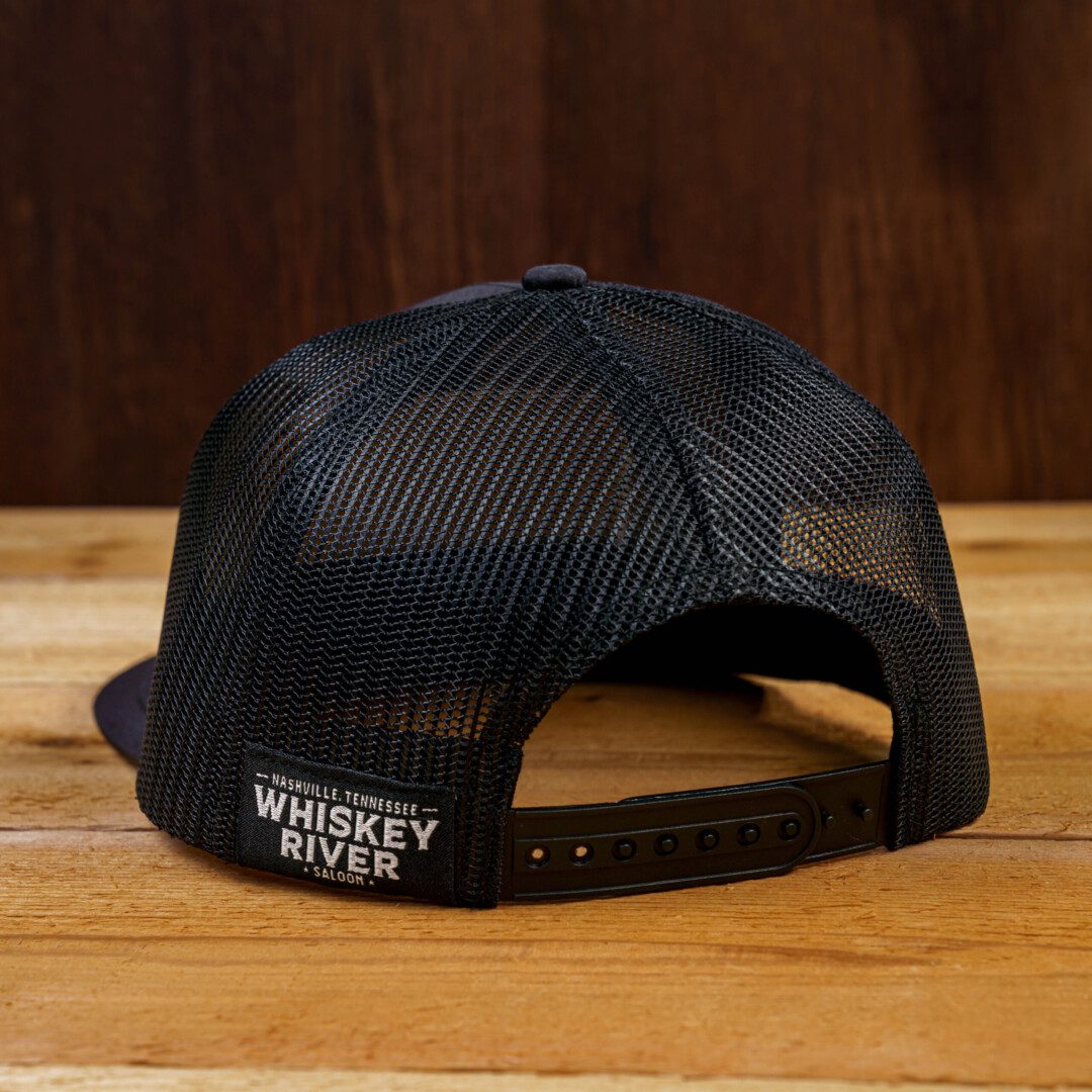 Whiskey river saloon Cap with a License Plate on the table