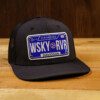 Whiskey river saloon Cap with a License Plate on the table