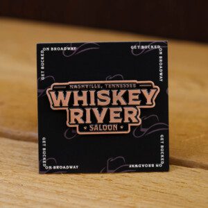 Whiskey river saloon logo with a brown background