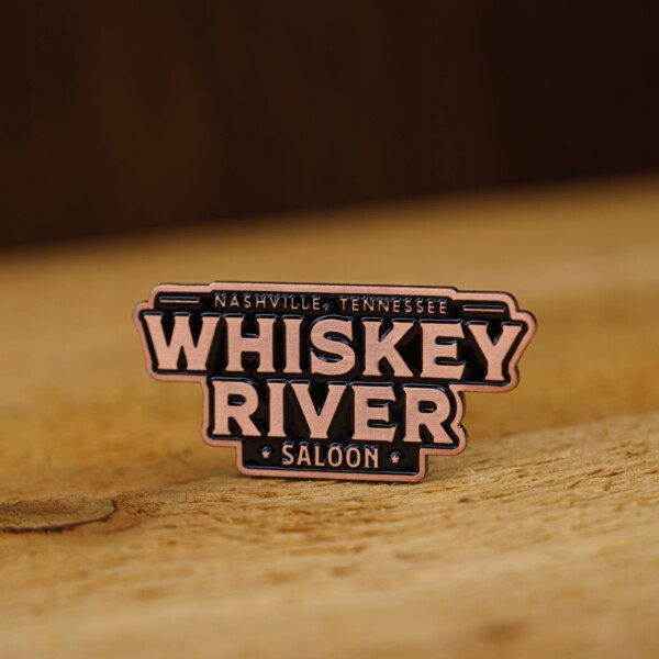 Whiskey river saloon enamel pin.
