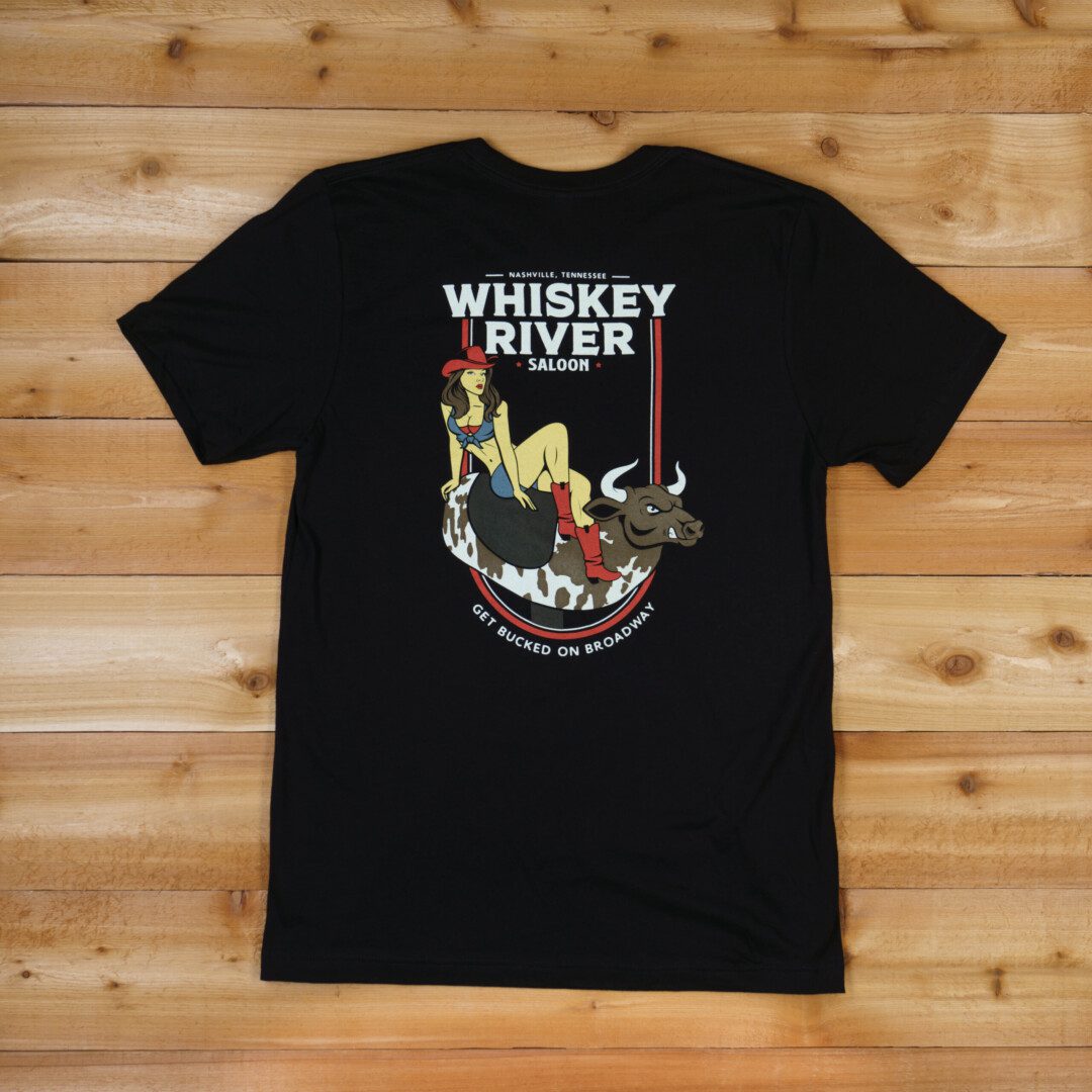 A black WRS T-Shirt - Pinup Bull that says whiskey river with an image of a woman riding a horse.