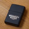 A WRS Zippo lighter with the word whiskey river on it.
