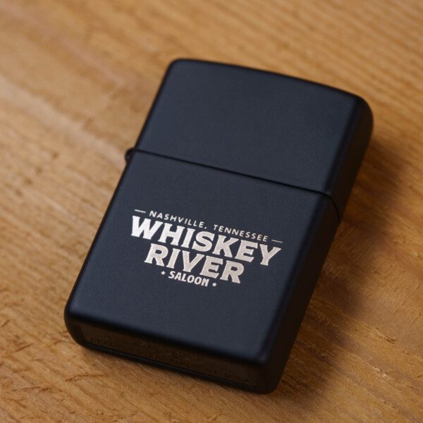 A WRS Zippo lighter with the word whiskey river on it.