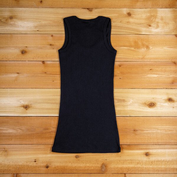 A black tank top is on the floor.