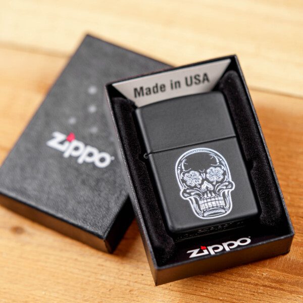 An LBS Zippo Lighter with a skull on it.